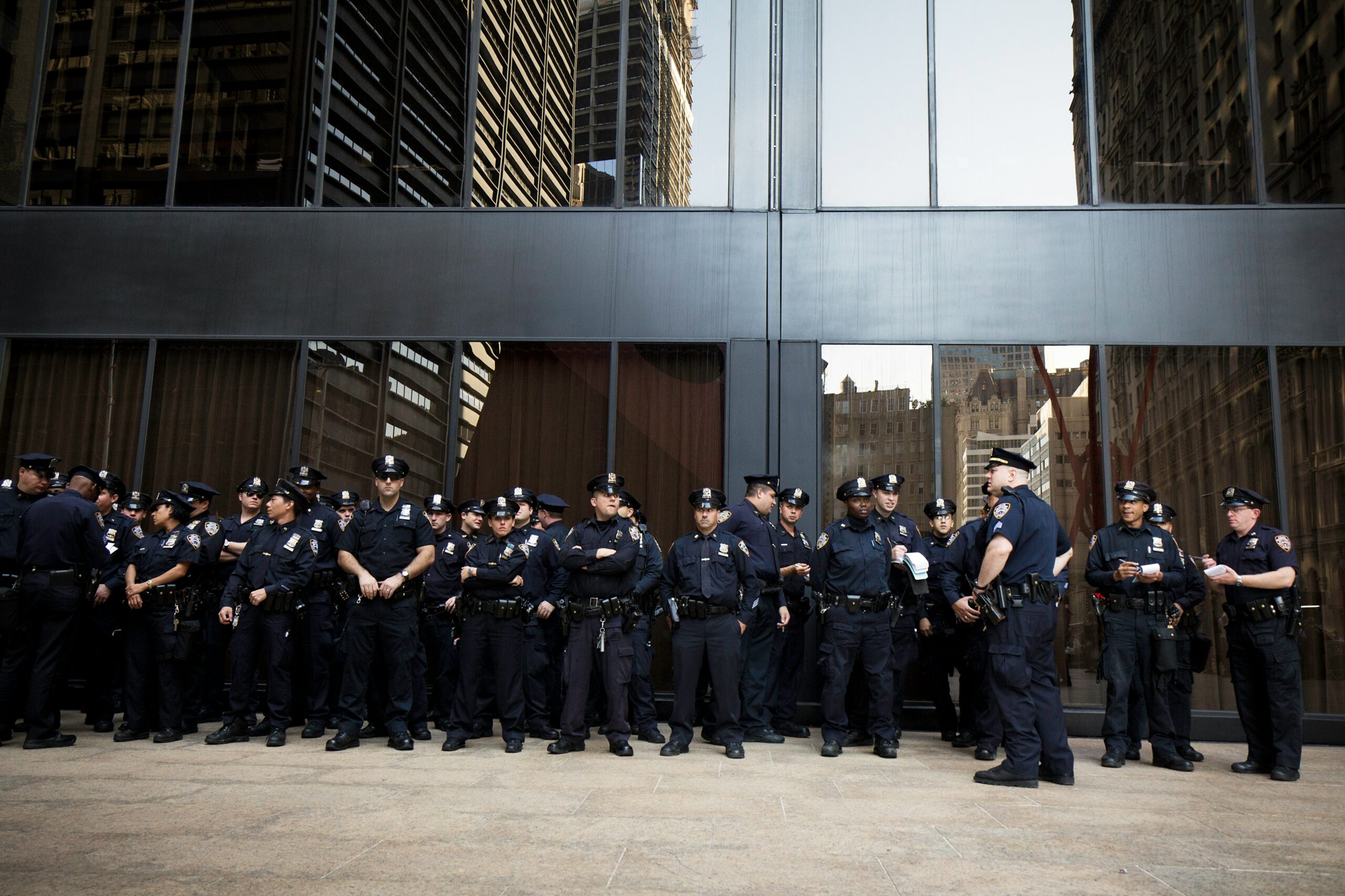police officers in uniform in front of office building