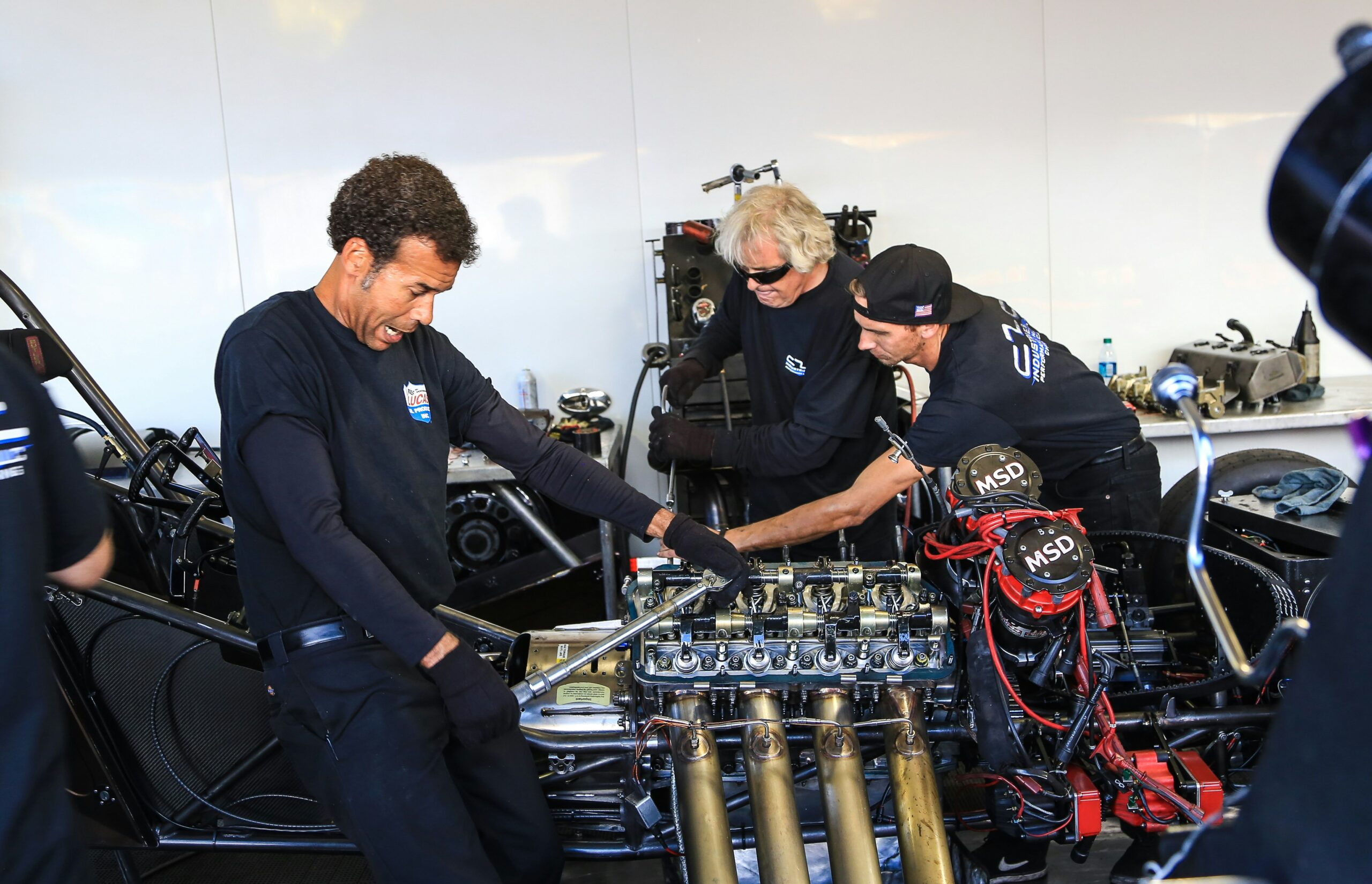 mechanics working on engine