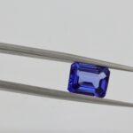 gemstone in tweezers