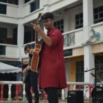 music student playing guitar