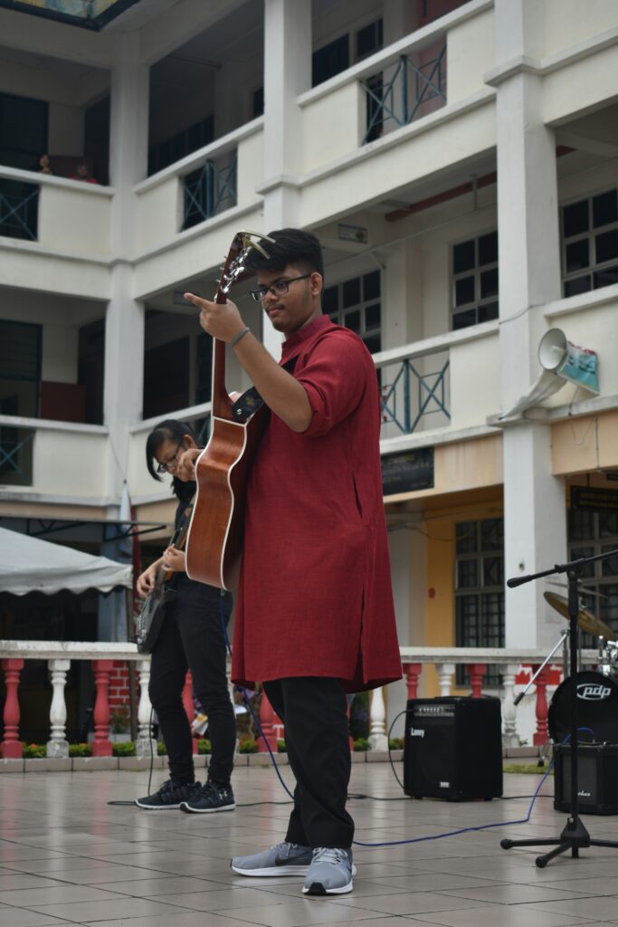 music student playing guitar